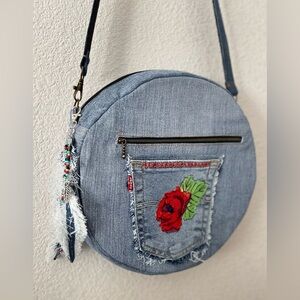 Upcycled denim jeans boho Round Crossbody bag with zipper and pockets.